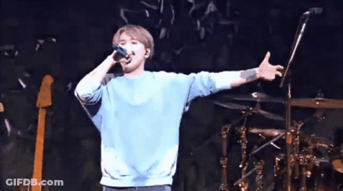 People Standing In Front Of Stage GIF
