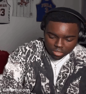 People Standing In Front Of Wall With VT Logos GIF