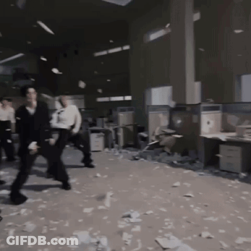 People Standing In Messy Office GIF