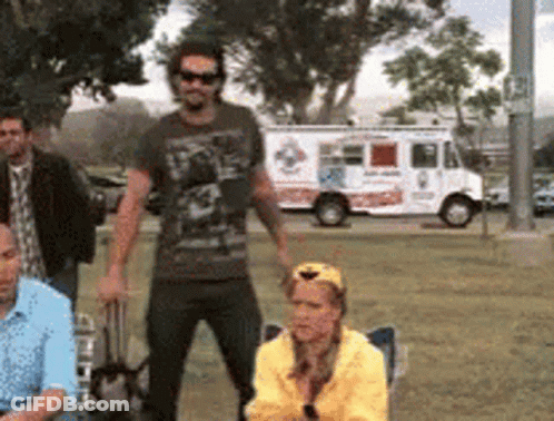 People Standing In Park Front Of Pizza Truck GIF