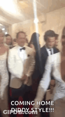 People Standing In Room With Sword GIF