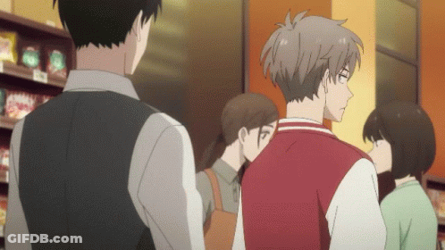 People Standing In Store With Red Jacket GIF