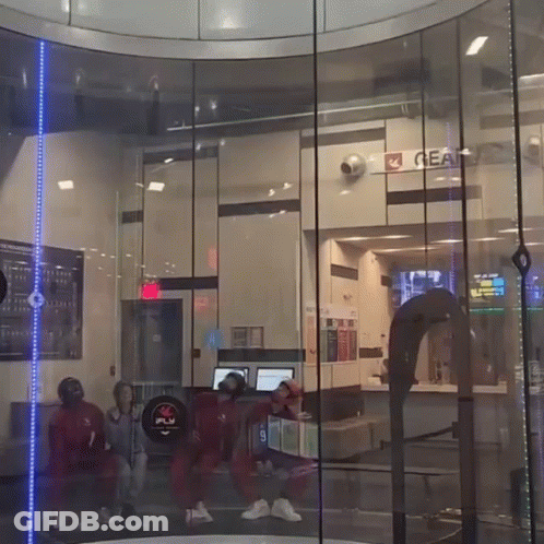 People Standing Next To Gear Sign GIF