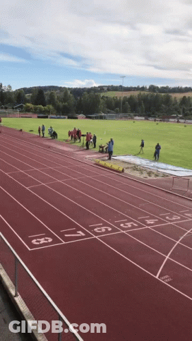 People Standing On Numbered Track 1 Through 9 GIF