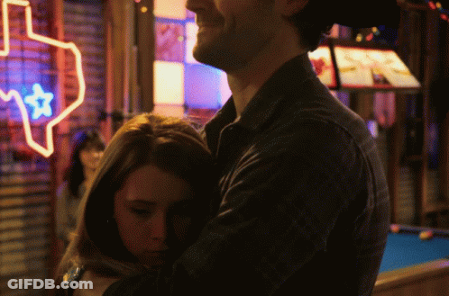 People Standing One In Yellow Jacket GIF