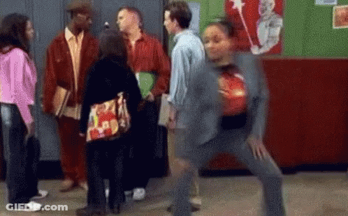 People Talking In Hallway Woman Holding Bowling Ball GIF