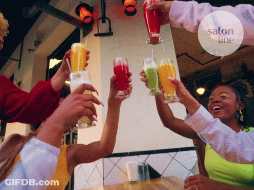 People Toasting Drinks In Front Of Salon Sign GIF