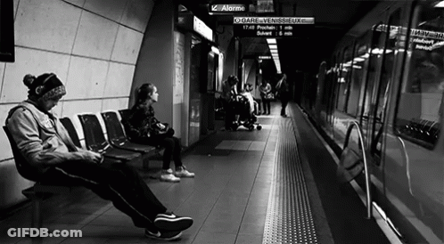 People Waiting For Train At Station GIF