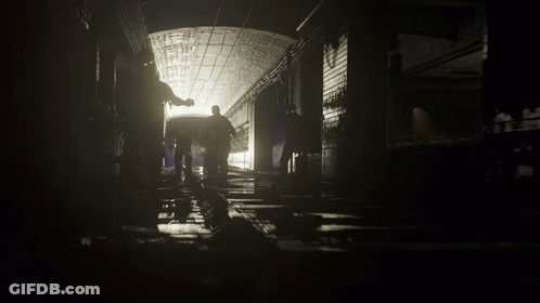 People Walking In Black And White Tunnel GIF