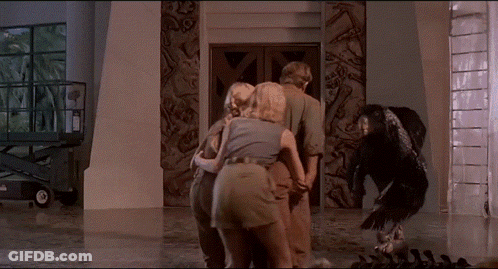 People Walking In Forest With Dinosaur In Fog GIF