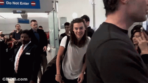 People Walking Past Do Not Enter Sign GIF