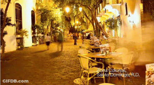 People Walking Zona Colonial Sign GIF