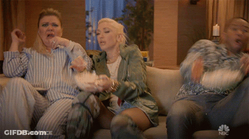 People Watching The Voice And Eating Popcorn GIF