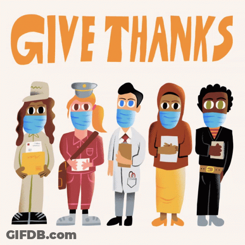 People Wearing Face Masks In Front Of Give Thanks Sign GIF