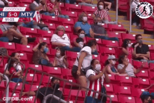 People Wearing Face Masks Watching Soccer GIF