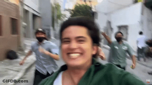 People Wearing Masks Running And Taking Selfie GIF