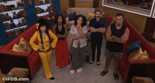 People With Arms Crossed By Red Couch GIF