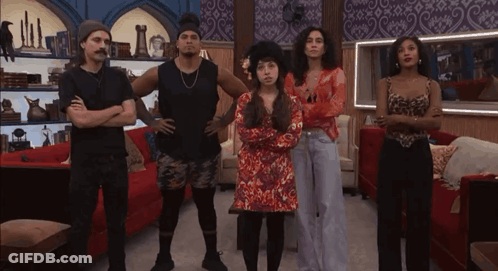 People With Arms Crossed In Living Room GIF