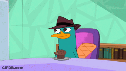 Perry The Platypus Sitting At Table With Cupcake GIF