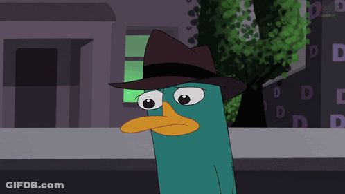Perry The Platypus Sitting At Table With Cupcake GIF