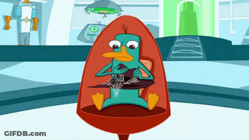 Perry The Platypus Sitting In A Chair GIF