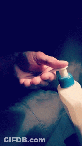 Person Applying Lotion With Blue Cap GIF