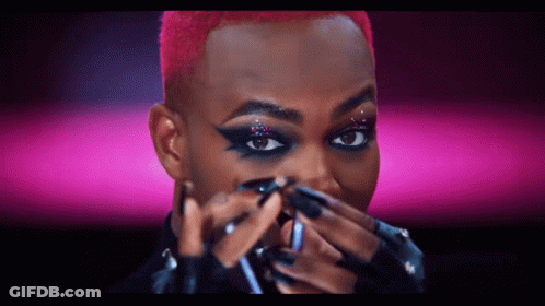 Person Applying Makeup On Pink Background GIF