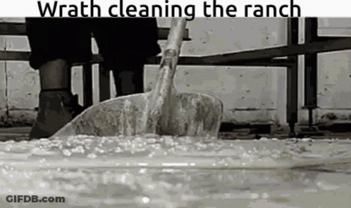 Person Cleaning Ranch With Shovel GIF