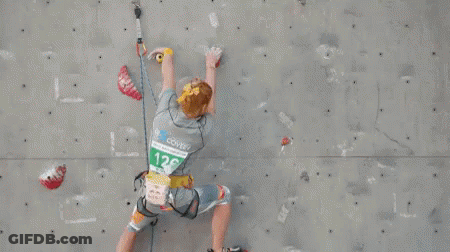 Person Climbing Wall With Number 128 Shirt GIF