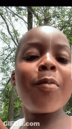 Person Close Up With Tree In Background GIF