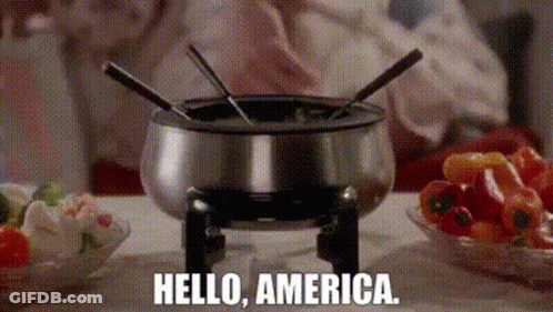 Person Cooking Fondue Saying Hello America GIF