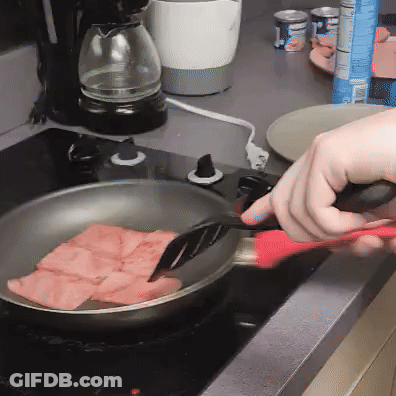 Person Cooking Ham In Frying Pan On Stove GIF