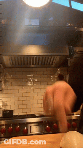 Person Cooking On Wolf Stove GIF
