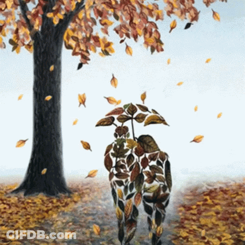 Person Covered In Leaves Holding Umbrella In Park GIF