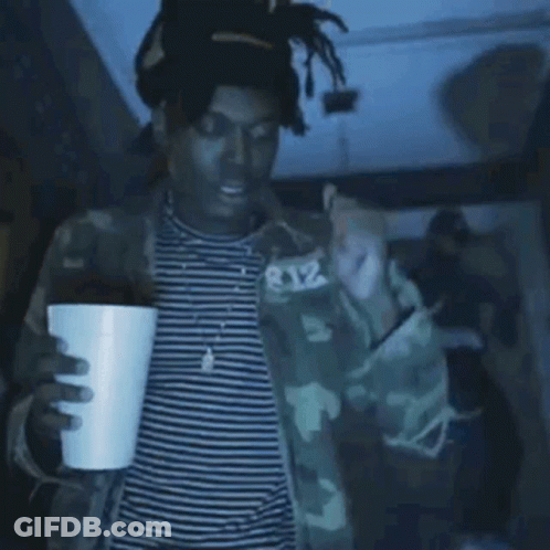 Person Covering Face In Purple Light GIF