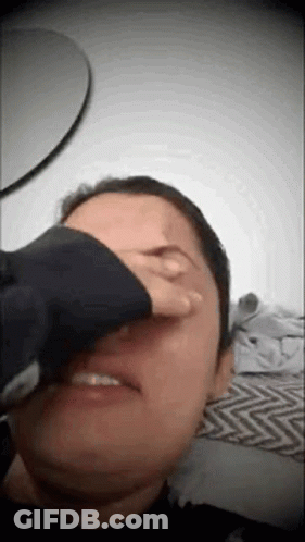 Person Covering Face With Hand GIF