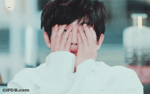 Person Covering Face With Hands Bottle Of Perfume GIF