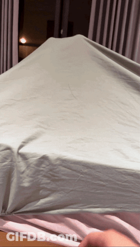 Person Covering Mattress With Sheet GIF