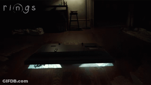 Person Crawling In Dark Room Saying Rings GIF