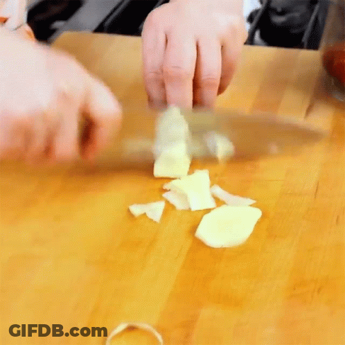 Person Cutting Garlic GIF