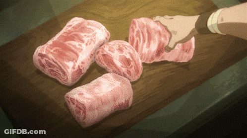 Person Cutting Meat On Wooden Board GIF