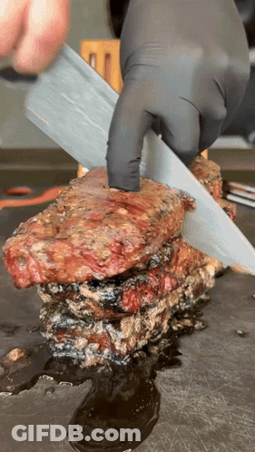 Person Cutting Meat With Knife GIF
