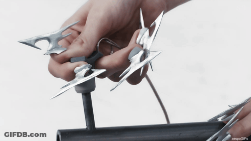 Person Cutting Metal With Scissors GIF