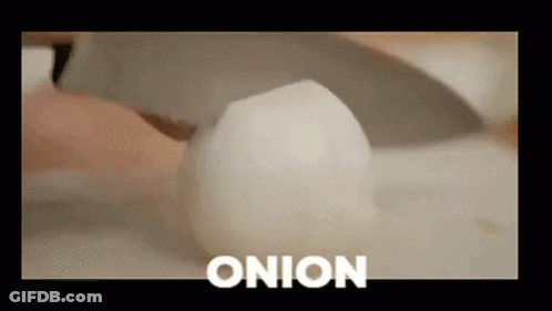 Person Cutting Onion GIF