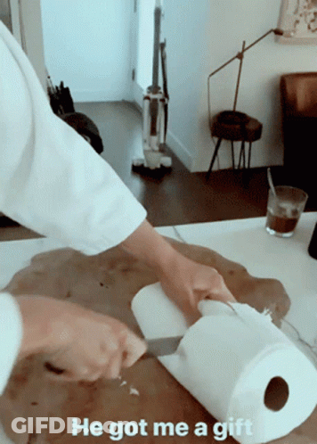 Person Cutting Paper Towels Saying He Got Me A Gift GIF