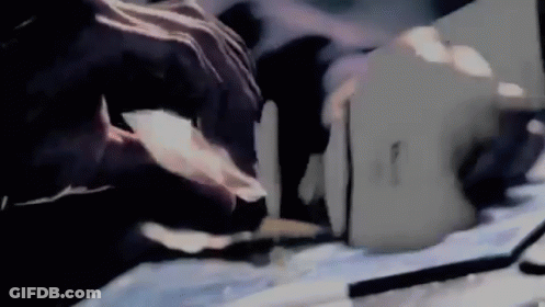 Person Cutting Paper With Knife GIF