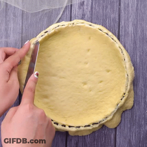 Person Cutting Pie Crust With Knife GIF