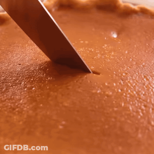Person Cutting Pumpkin Pie With Knife GIF