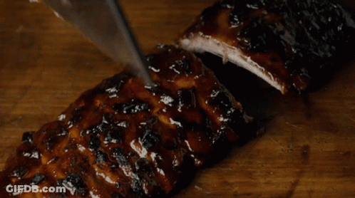 Person Cutting Ribs With Knife GIF