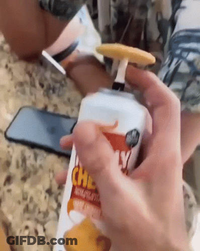 Person Cutting Trentino Cheese On Cutting Board GIF
